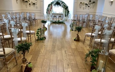 Ceremony Decor - floral moongate, olive trees, lanterns, aisle decor.