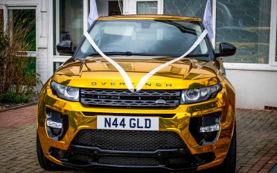 Gold Range Rover Front with Ribbon
