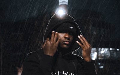 Night photography can get tricky but this photo shows how creative you can get with the rain and a light behind the subject and turns up to he very dramatic and moody