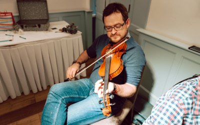 Jon plays fiddle