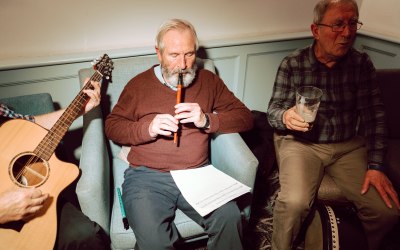 Denis plays the whistle, JIim plays the bodhran and sings