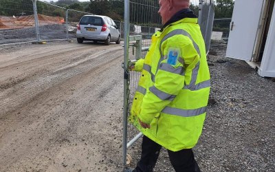 Our site security staff locking up after a delivery.