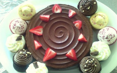 chocolate fudge cake topped with strawberries
