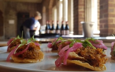 Pork tostada, pink onions