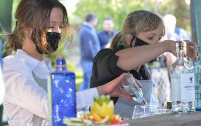 Team members serving on the bar area