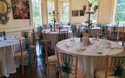 Forest green organza sash with silver candelabra