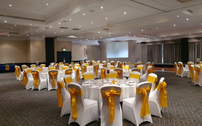 Yellow gold taffeta sash with white chair cover