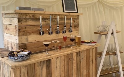 Large events bar dispensing cocktails, pink fizz, wine and lager