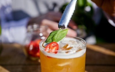 Garnishing a 'Spicy Basil & Juice'