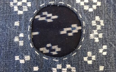 Hitomezashi Sashiko mend using vintage Kasuri fabric on jeans