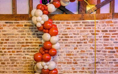 7ft-arch-frame-with-red-and-cream-garland.png