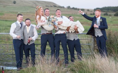 groomsmen-lifting-the-bride-having-a-blast-at-the-wellbeing-farm.jpg