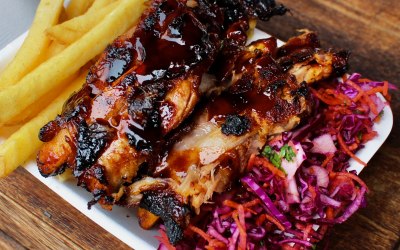 Baby back ribs glazed in our BBQ sauce with fries and pickled slaw