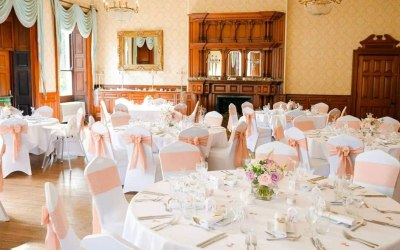 Alfreton Hall, chair covers, blush linen sashes and floral centerpieces