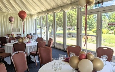 Table decoration; Balloon centrepiece and table runner.