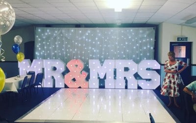 Mr and Mrs Letters along with Backdrop and Dancefloor
