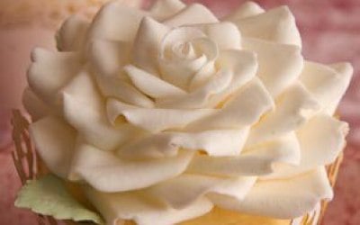 Wedding cupcakes with intricate sugar rose toppers