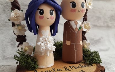 Cute wooden bespoke custom bride and groom wedding cake toppers