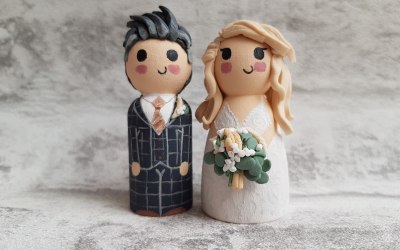 Clay grey groom and blonde bride toppers.