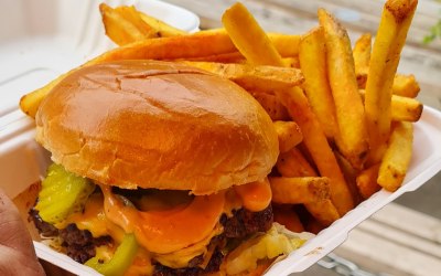 Our yummy  handmade double patty beef smash burger with herby seasoned fries 