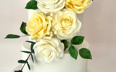 Spring wedding cake with yellow hand made sugar flowers