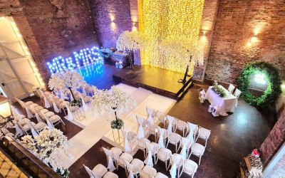 Wedding ceremony featuring weeping blossom trees, mr and mrs letters and 6ft round backdrop hoop