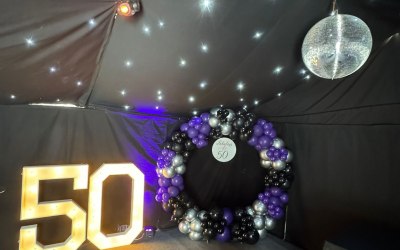 4ft light up numbers 50 and a balloon hoop with a personalised sign for a customer in Northampton