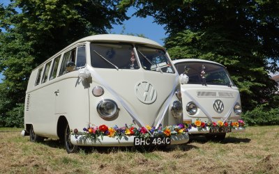 pair of wedding camper vans