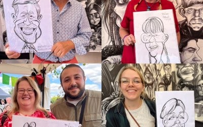 Lots of happy folks with their caricatures