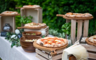 Pizzas presented on beautifully decorated tables