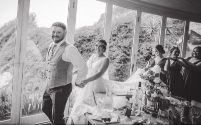 Surprised Bride and Groom lead the conga