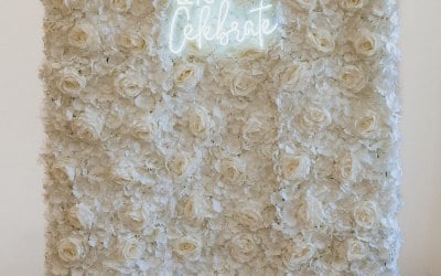 Flower Wall with neon sign