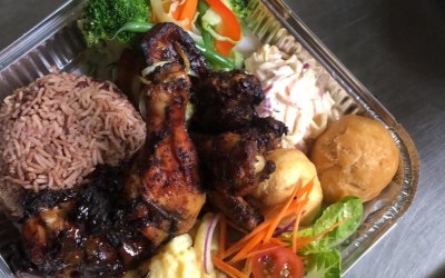 Smoky Jerk Chicken, Rice + Peas, Mac + Cheese, Coleslaw and Dumpling