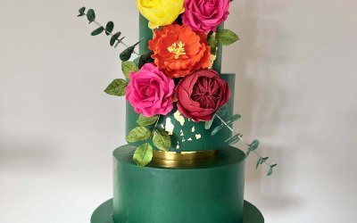 4 tier forest green wedding cake with gold leaf and hand made sugar flowers