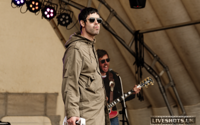 High zoom capture of Oasis tribute act on stage