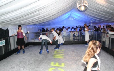 Skaters on a mobile ice rink in one of our marquees