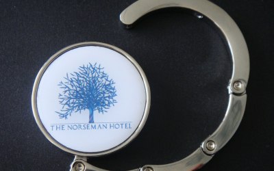Custom design for hotel giveaways, round So-Hooked handbag hook with wraparound hanger