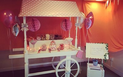 Baby pink 1st birthday party candy cart with matching wishing well post box 
