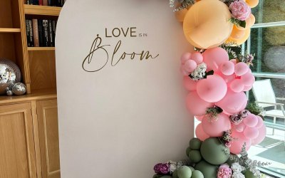 white 6 ft sailboard with balloons and floral decor and personalised vinyl