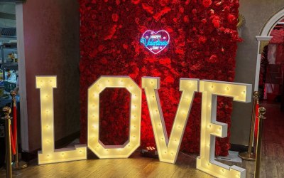 4ft Light up letters LOVE with a red flower wall and neon sign - flower wall is also available in White
