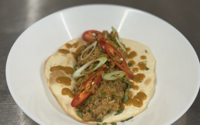 Rosemary chicken and haggis ragu taco.