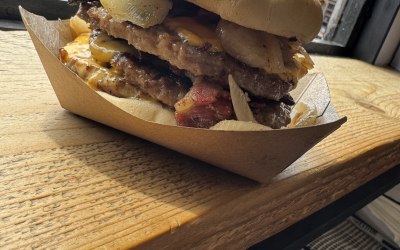 Triple burger with fried onions 