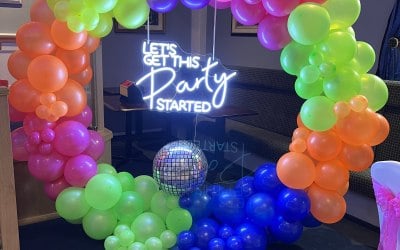 Balloon hoops with party neons to suit event ( happy birthday, mr and mrs, 21,30 etc)