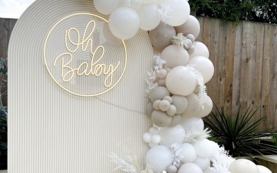 Rippled sail board with neon sign & balloons 