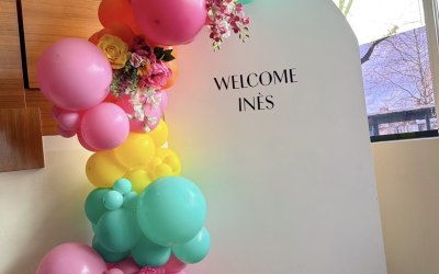 Colourful balloon garland with personalised backdrop 