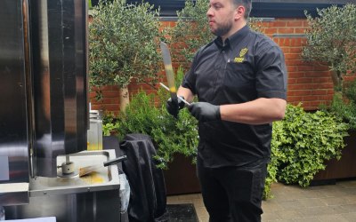 Executive Chef Eren Emin in action, carving guest side.