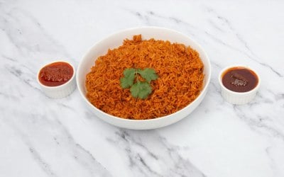 Jollof rice bowl with Shito( spicy chilli sauce and tomato sauce 