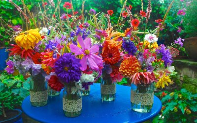 Jazzy jars containing a colourful mix of summer country flowers