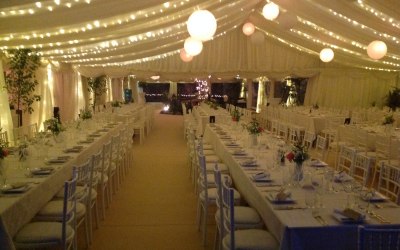 Straight tables, wedding marquee, fairy lighting