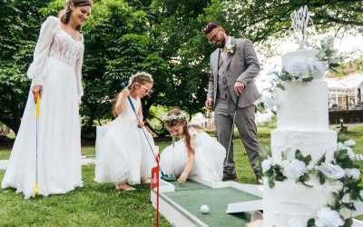 Bride & Groom playing crazy golf (puttputtgolf)